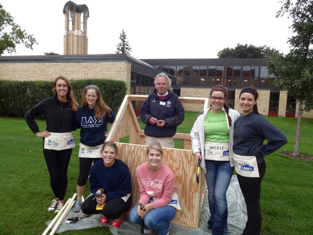 A group of LDS members help build playhouses for Habitat for Humanity's Playhouse Project. Submitted photo.