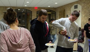 Kristin Remick serves pancakes to students attending pancake feed in East Complex. The feeds served as a fundraiser for Fill the Dome, as students were asked to bring canned goods to donate. Photo by Chase Body.