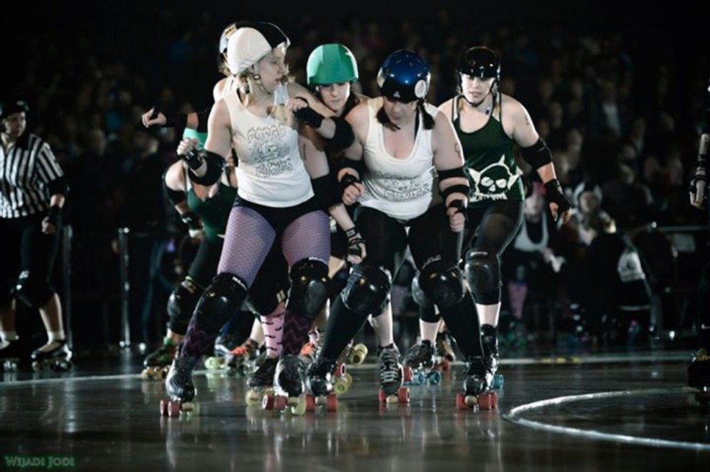 Members of the Fargo-Moorhead roller derby team say that one of their favorite parts of a bout is the physical contact with the other team. Submitted photo.