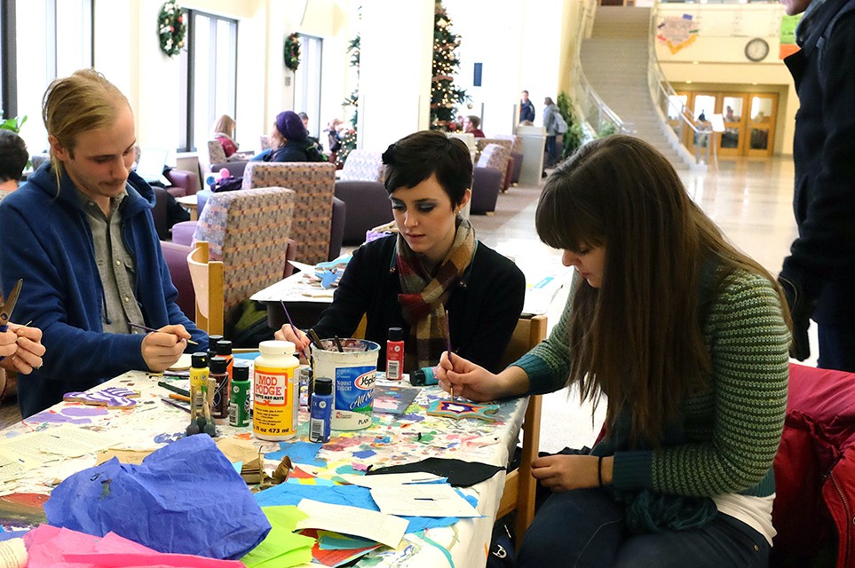 Dan Will and Solveig Swenson focus intently on their art as they participate in the art club's collage project. The art club set out a table with paints, Mod Podge and other craft items for students to design puzzle pieces in whatever way they choose. The art club hopes to display the collage for the first time during the winter Cobber Expo and its currently searching for a forever home on campus. Submitted by Sheldon Green.