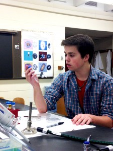 Sophomore Andrew Olsen works in a biology lab with various materials. Olsen is able to balance many activities in his life including class, labs and homework and his work as an emergency medical technician every other weekend. Submitted photo.