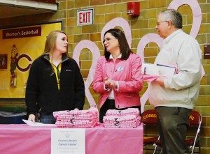Women's head basketball coach, Jessica Rahman, is pictured above i the middle at the car it booth during Saturday's events to raise awareness for cancer, drunk driving and giving shoes to those without. Photo by Morgan Schleif.