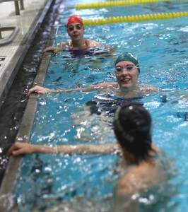 Top to bottom: Abby Gunderson and Maddie Peterson hang out before taking a lap in the pool. Photo by Maddie Malat.
