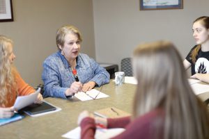 Cathy provides students with feedback during a feature writing class. Photo by Maddie Malat.