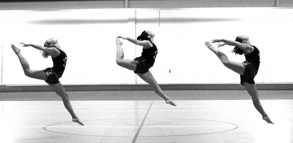 Abby Berglund, Shannon Flanery and Amy Crane practice their firebird technique during a Tuesday night practice in Olson Forum. Photo by Morgan Schleif.