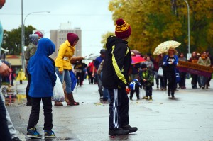 Children anxiously wait for candy to be thrown their way during the homecoming parade. Photo by Chase Body.