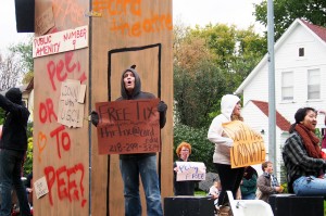 Upcoming Concordia Urinetown displayed some of their set in the homecoming parade. Photo by Chase Body.