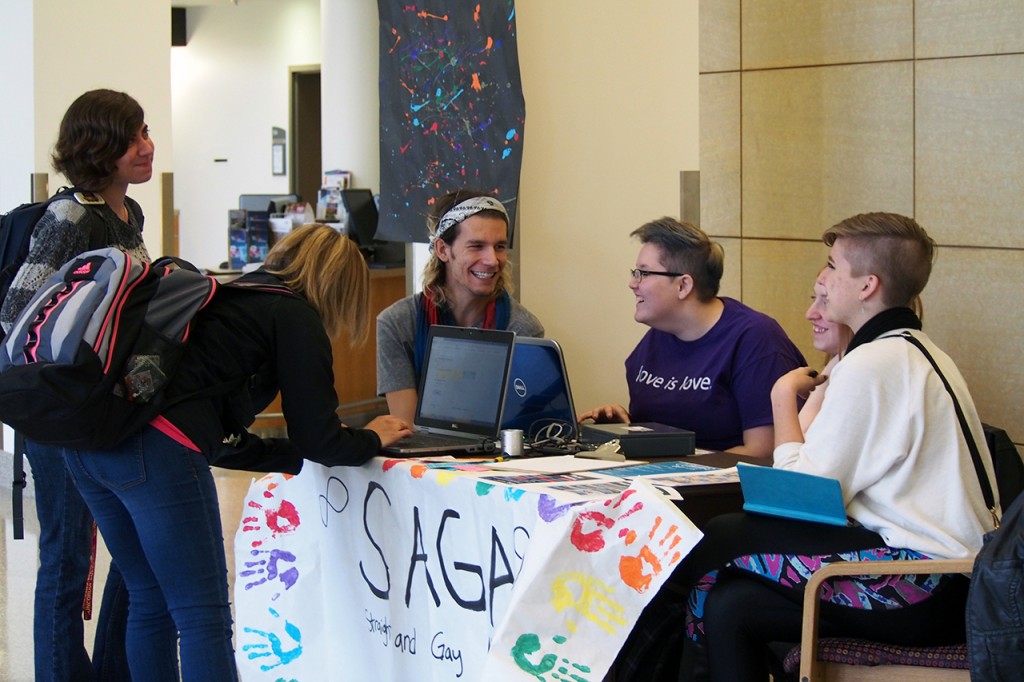 SAGA members manned a table in the Atrium during Coming Out Week. Concordia students could stop by to get a photo taken of them with a whiteboard message related to LGBTQ issues. Photo by Morgan Schlief.