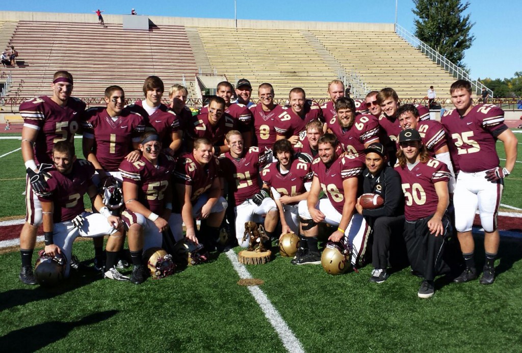Senior football players pose with The Troll trophy.  Photo submitted by Roger Tamm.