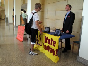 SGA President Levi Bachmeier encouraging people to vote for their class representative. Photo by Aubrey Schlied.