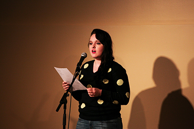 Junior Margaret Wollenzien recited a poem about becoming aware of global issues. The poem encouraged individuals to work together to make a positive change in the world. Photo by Chase Body.