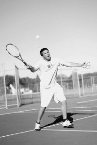 Cobber tennis player Isaac Toivonen returns a serve to start the volley.  Photo by Maddie Malat.