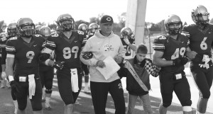 Coach Horan leads Concordia’s football team to a win over Bethel. Photo by Maddie Malat.