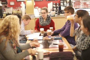 Executive borad member Natalie Dulca shares coffee and thoughts with Caleb Christiansen, Noah Bray and other club members during the Coffee and Tea intersectional event for Feminism Club. Photo by Maddie Malat.