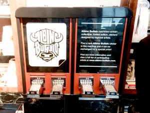 One of Albino Buffalo’s sticker dispensers located at Unglued, in Fargo. Photo by Emely Kransvik.