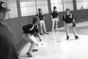 Men’s baseball players began their season Feb. 1, with the team practicing indoors because of weather. The men’s home season opening game is scheduled for March 28 against Jamestown. Players and coaches are hopeful that the weather will cooperate with their game schedule. Photo by Maddie Malat.