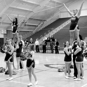 Cobber cheerleaders practice stunting. Men and wom- en on the team have varying experience levels. The student-led team welcomes anyone to tryout March 7 through 10 in Olson Forum. Photo submitted by the Concordia College Sports Information Office.